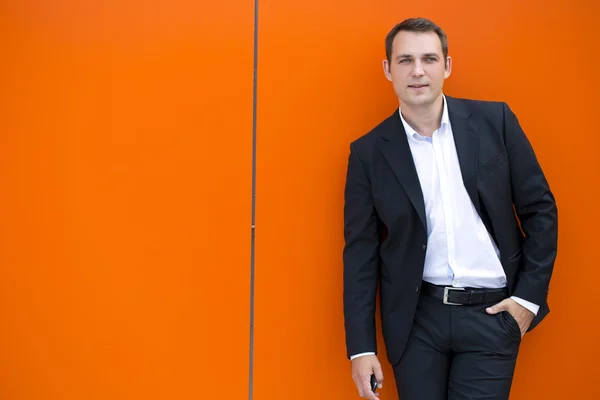 Portrait of a young business man in a dark suit and white shirt — Stock Photo, Image