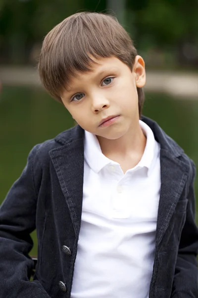 Fashionable little boy outdoor at the nice summer day — Stock Photo, Image