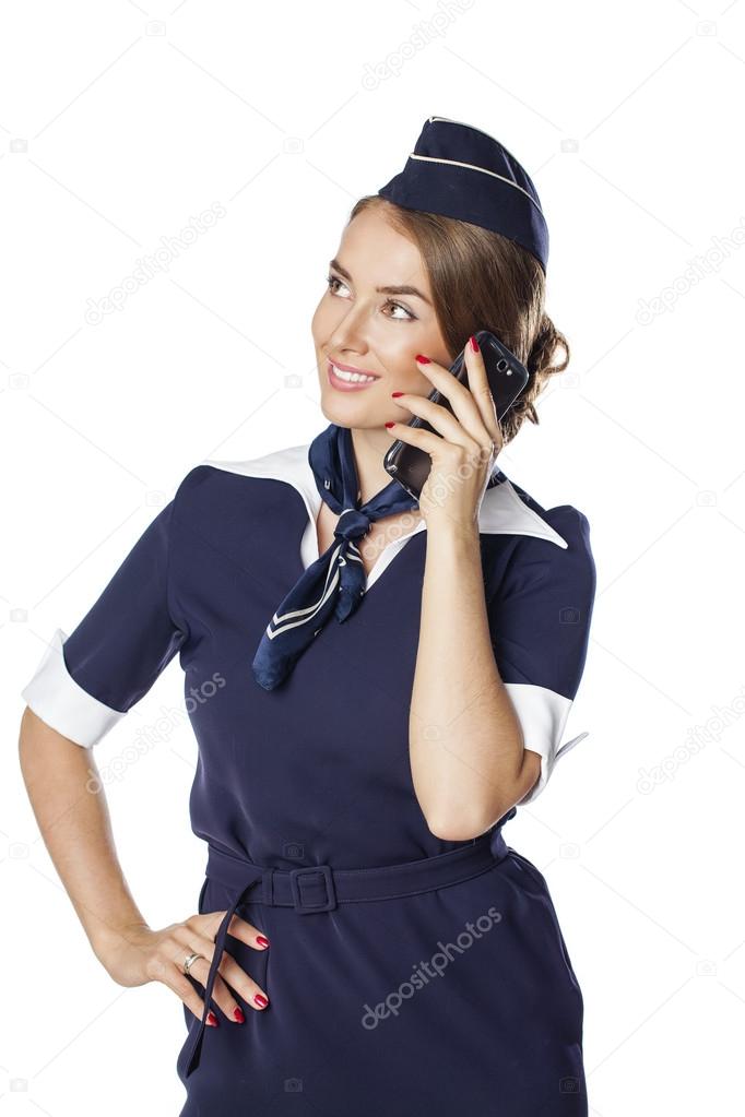 Happy young stewardess calling by phone isolated on white backgr