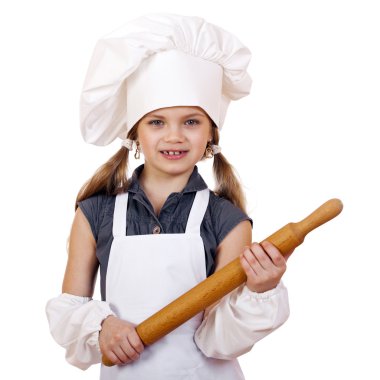 Yemek ve insanlar kavramı - aşçı şapkalı küçük kız gülümseyerek