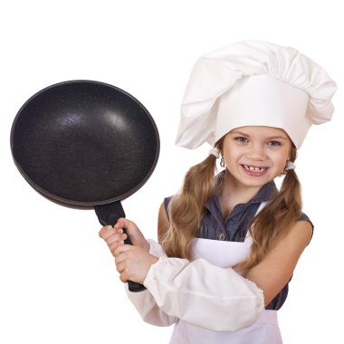 Tava ile aşçı şapkalı küçük kız gülümseyerek