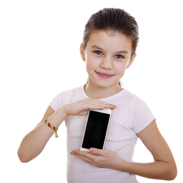 Jovem menina bonita mostra um novo telefone inteligente — Fotografia de Stock