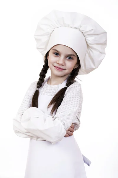 Cooking and people concept - smiling little girl in cook hat — Stock Photo, Image