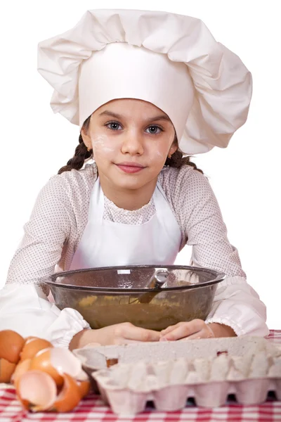 烹饪和人们的观念-微笑在厨师的帽子的小女孩 — 图库照片