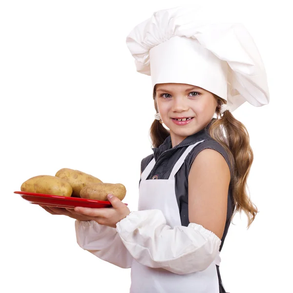 Cozinhar e conceito de pessoas - menina sorridente em chapéu de cozinheiro — Fotografia de Stock