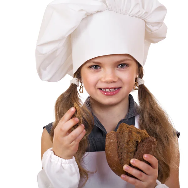 Cooking and people concept - smiling little girl in cook hat — Stock Photo, Image