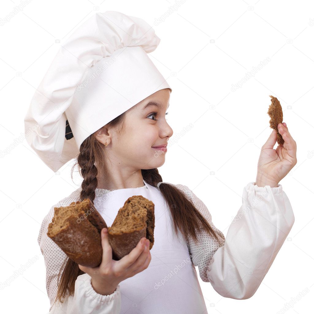 Cooking and people concept - smiling little girl in cook hat 