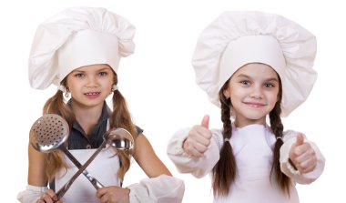 Yemek ve insanlar kavramı - iki küçük kız beyaz bir önlük 