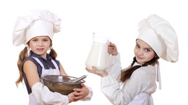 Yemek ve insanlar kavramı - iki küçük kız bir beyaz önlükle h