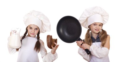 Yemek ve insanlar kavramı - iki küçük kız bir beyaz önlükle h