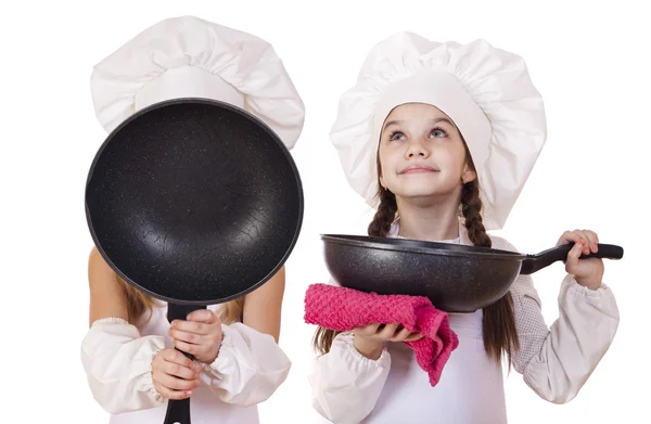 Cooking and people concept - Two Little girls in a white apron — Stock Photo, Image