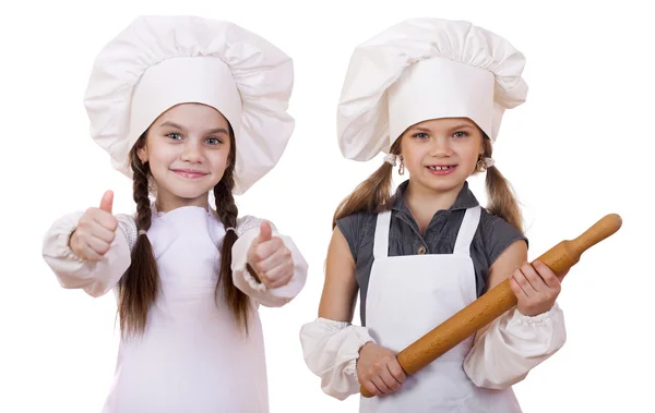 Yemek ve insanlar kavramı - iki küçük kız beyaz bir önlük — Stok fotoğraf