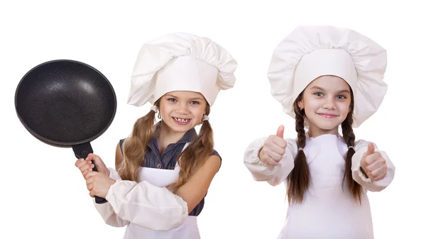 Cozinhar e conceito de pessoas - Duas meninas em um avental branco — Fotografia de Stock