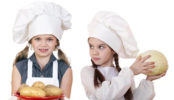 Cooking and people concept - Two Little girls in a white apron — Stock Photo, Image