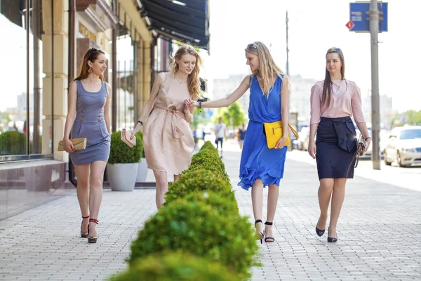 Four beautiful fashion girls walking on the street — Stock Photo, Image