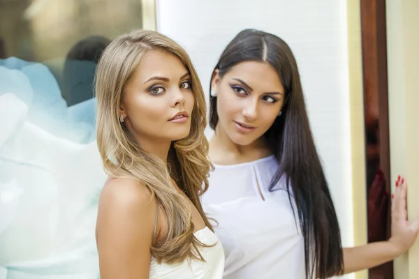 Glamorous portrait of two young beautiful women — Stock Photo, Image