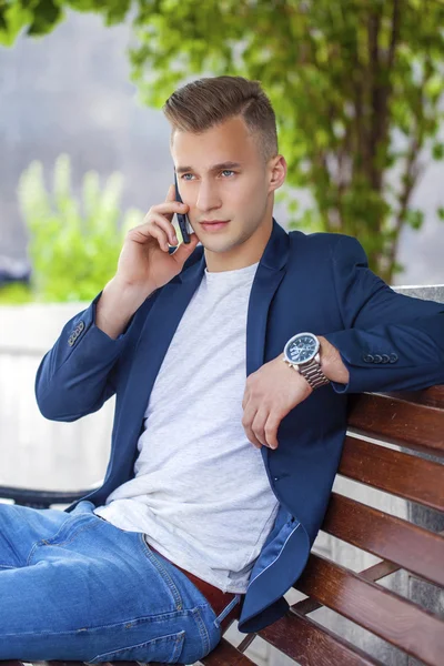 Young men calling by phone — Stock Photo, Image