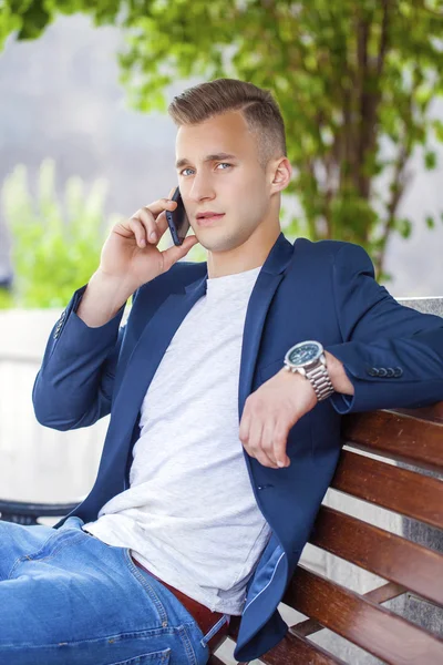 Young men calling by phone — Stock Photo, Image