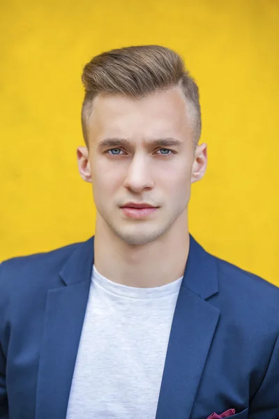 Calm handsome man on the background of summer street — Stock Photo, Image