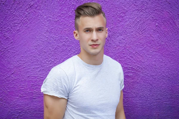 Calm handsome man on the background of summer street — Stock Photo, Image