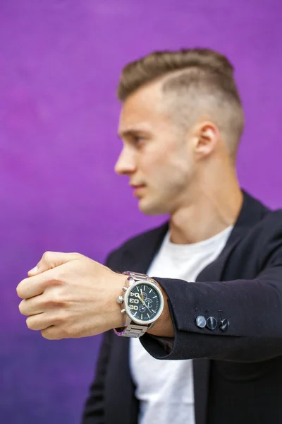 Calm handsome man on the background of summer street — Stock Photo, Image