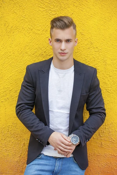 Calm handsome man on the background of summer street — Stock Photo, Image