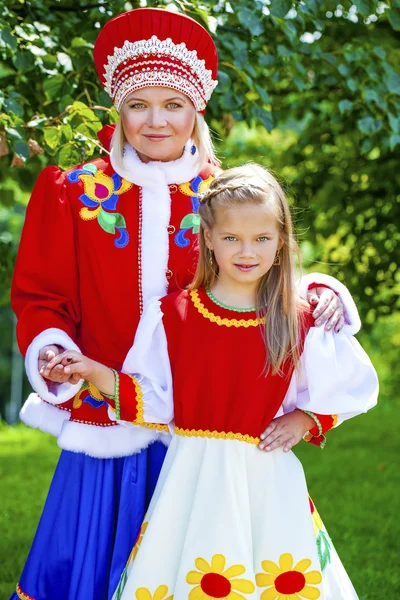 Portrait of mother and daughter in a national Russian costume — Stock Photo, Image