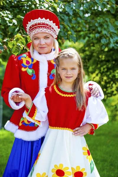 Portrait of mother and daughter in a national Russian costume — Stock Photo, Image