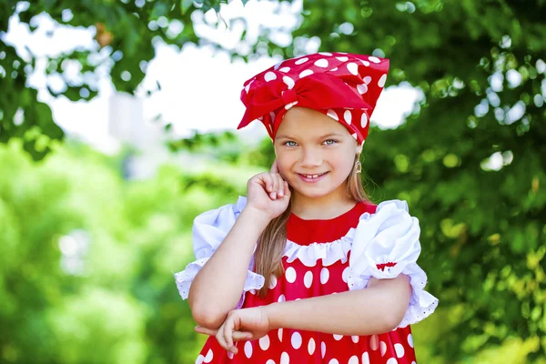 Portrait of a charming little girl looking at camera — Stock Photo, Image