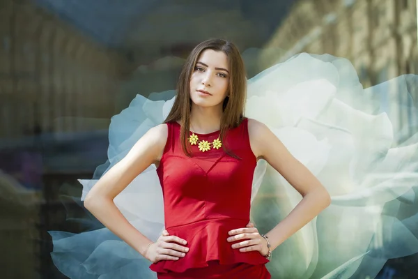 Sultry portrait of sexy brunette in a red dress — Stock Photo, Image