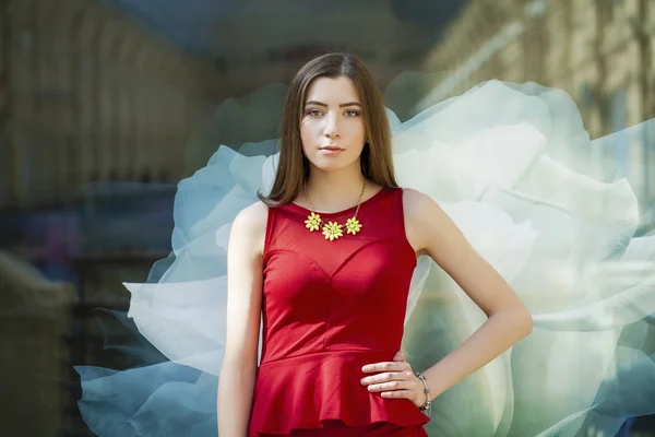 Sultry portrait of sexy brunette in a red dress — Stock Photo, Image