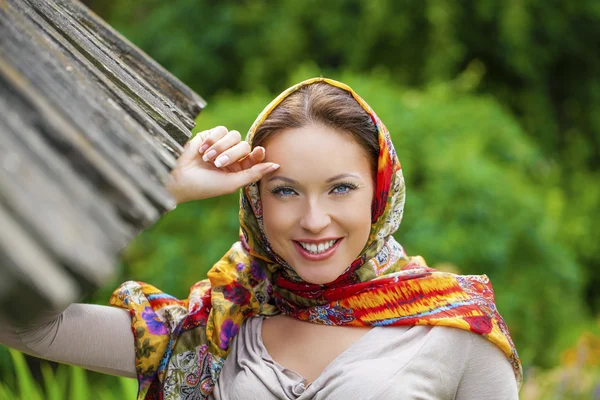 Beautiful young woman in sexy long gray dress in summer park — Stock Photo, Image