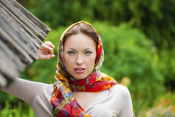 Beautiful young woman in sexy long gray dress in summer park — Stock Photo, Image