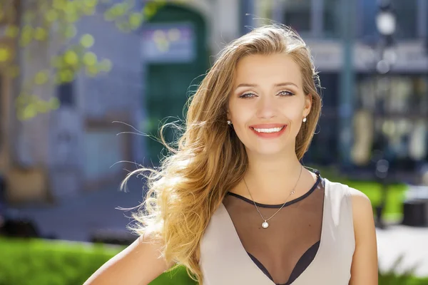 Portrait close up of young beautiful blonde woman, on background — Stock Photo, Image