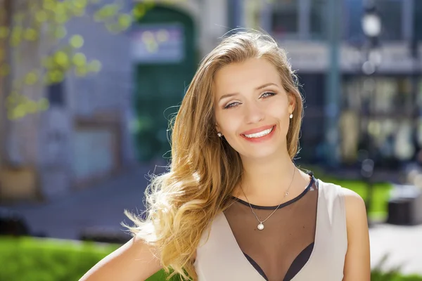 Portrait close up of young beautiful blonde woman, on background — Stock Photo, Image