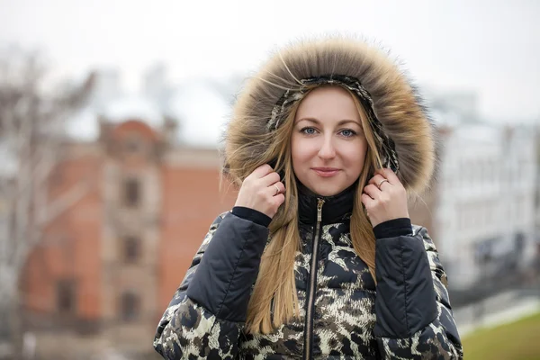 Young beautiful blonde woman in fur hood — Stock Photo, Image