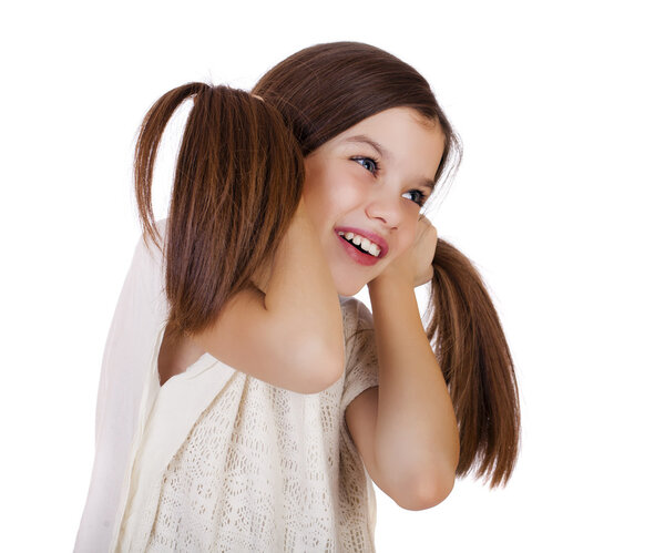 Portrait of a charming little girl smiling at camera