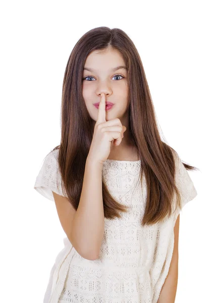 Little girl has put forefinger to lips as sign of silence — Stock Photo, Image