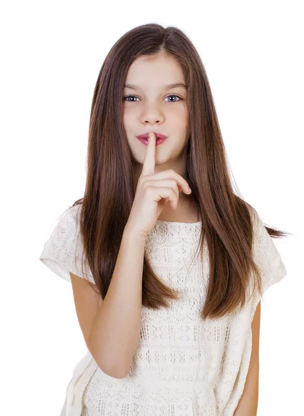 Little girl has put forefinger to lips as sign of silence — Stock Photo, Image