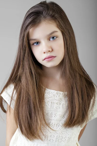 Portrait of a charming brunette little girl — Stock Photo, Image