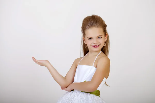 Portrait of a little girl in white classic dress — Stock Photo, Image