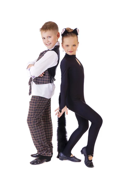 Tančící děvčátko oblečené jako kočka a chlapec v kostkované vesty — Stock fotografie