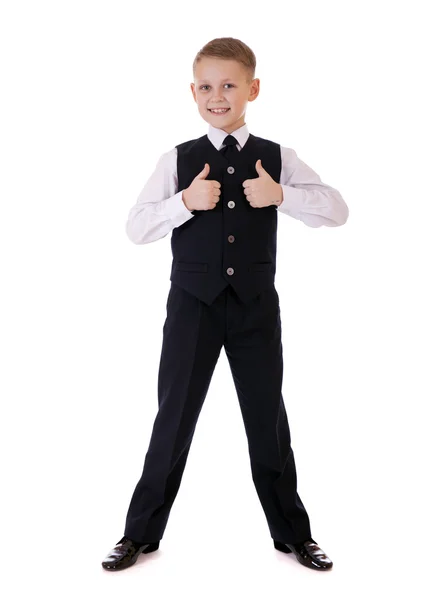 Retrato de longitud completa de un niño en un traje de pie con bolsa de escuela —  Fotos de Stock