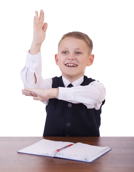 Kaukasische Schuljunge an seinem Schreibtisch auf weißem Hintergrund mit Kopie s — Stockfoto