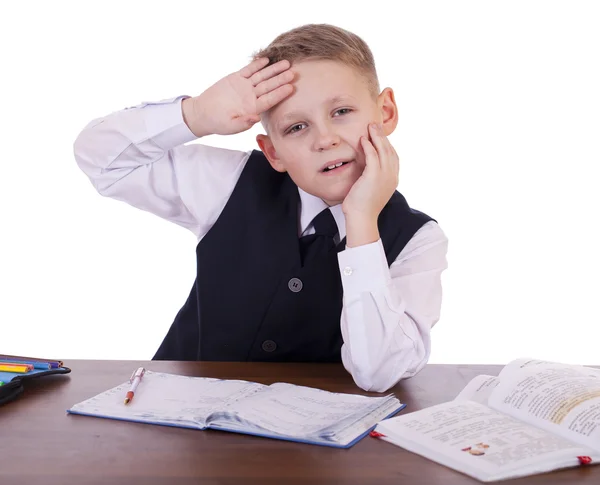 Der Zehnjährige, der am Schreibtisch sitzt — Stockfoto
