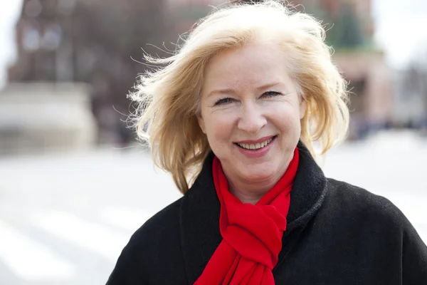 Happy portrait of an elderly blonde woman — Stock Photo, Image