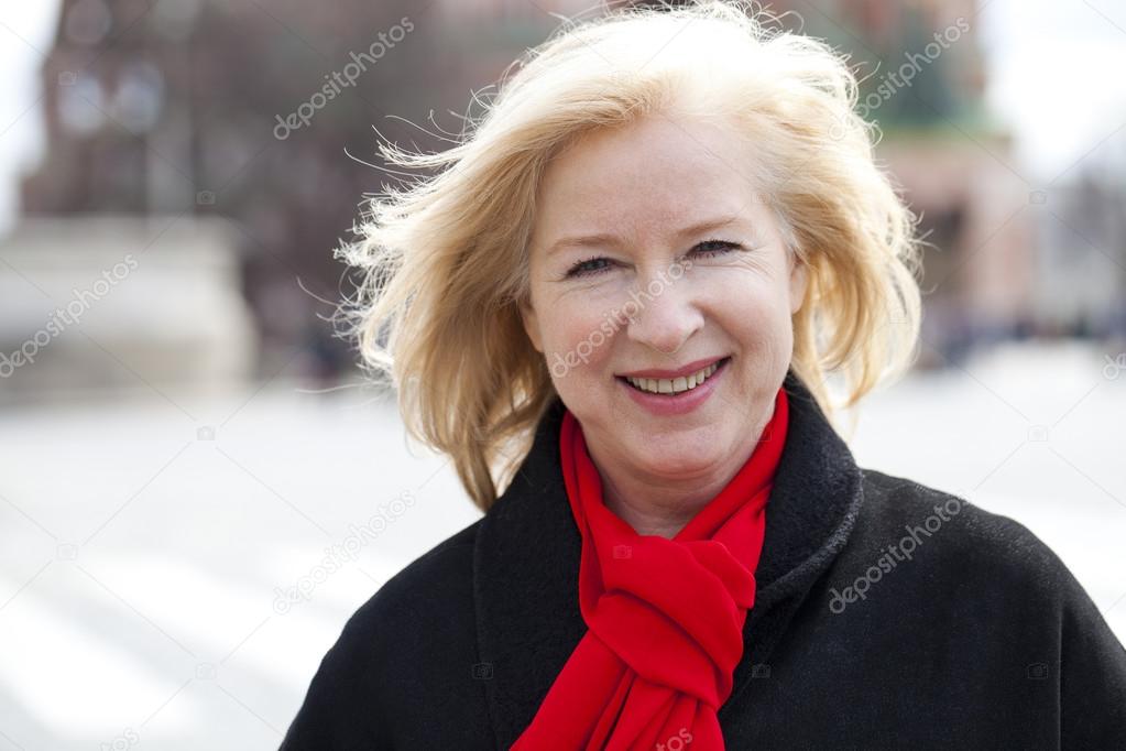 Happy portrait of an elderly blonde woman