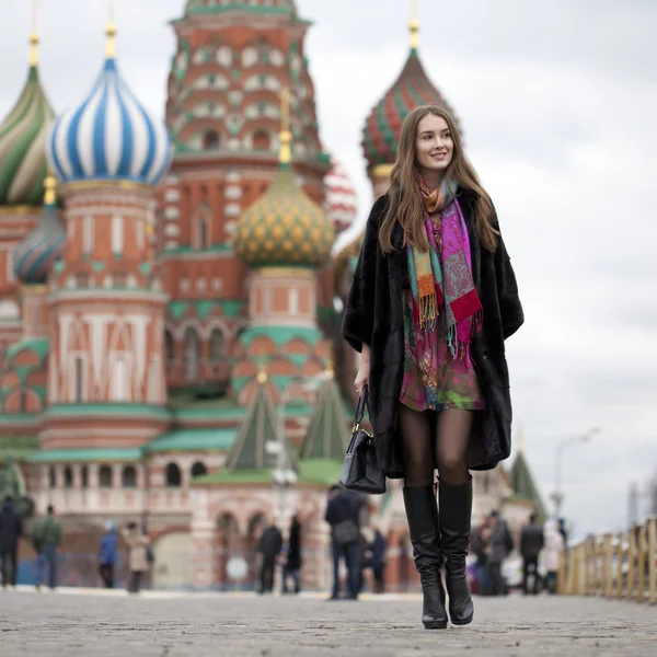 Young woman in a mink coat on the Red Square in Moscow Stock Image