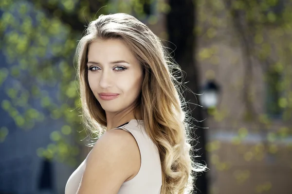 Portrait close up of young beautiful blonde woman, on background — Stock Photo, Image