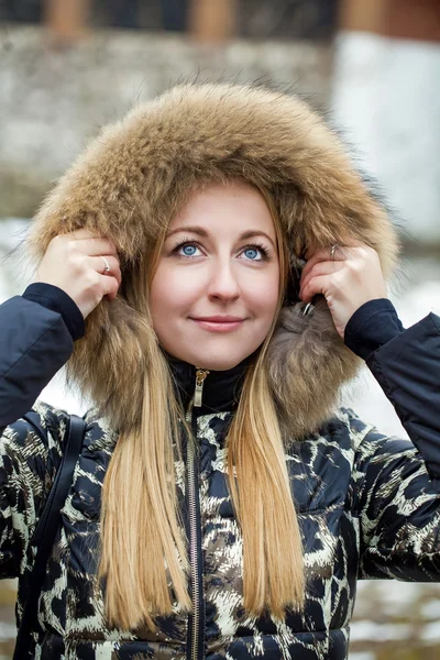 Young beautiful blonde woman in fur hood — Stock Photo, Image